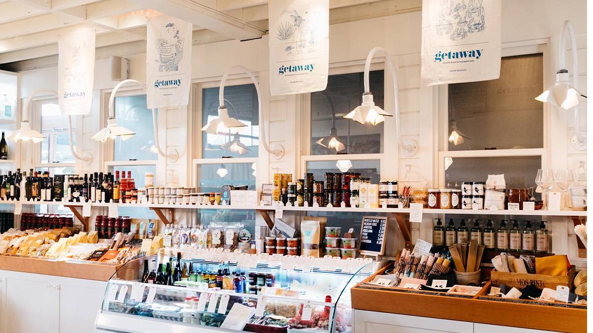Deli area filled with cheese, jams, and other goodies at The Whale Wins in Seattle, Washington, USA